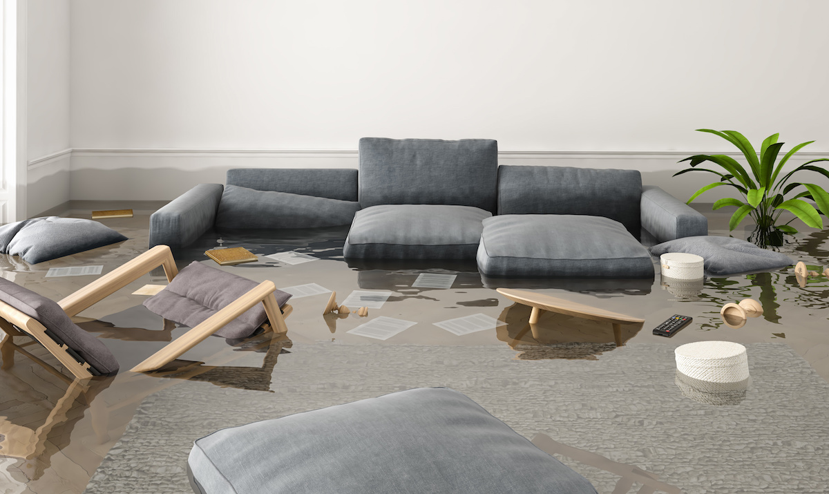 Standing water in a room. Water-damaged furniture.